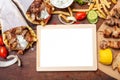 Gyro pita, shawarma. Two pita bread wraps with meat, and blank board on wooden table, copy space Royalty Free Stock Photo