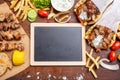 Gyro pita, shawarma. Two pita bread wraps with meat, and blank board on wooden table, copy space Royalty Free Stock Photo