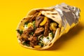 Gyros tasty fast food street food for take away on yellow background