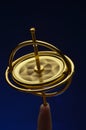 Gyroscope balanced on finger tip Royalty Free Stock Photo