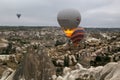 View from the observation deck of the village of GÃÂ¶reme on the flight of balloons over the valleys