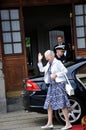 H.M.the Queen Margrethe II of Denmark arrives with her pet Royalty Free Stock Photo