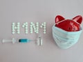 H1N1 flu vaccine and syringe in patient immunization Royalty Free Stock Photo