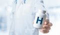 H Vitamin, H supplements for human health. Doctor recommends taking vitamin H. doctor talks about Benefits of H. Essential Royalty Free Stock Photo