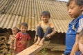 Ha Giang, Vietnam - Apr 12, 2014: Unidentified Hmong children playing on playground in front of there houses under sunlight. The H