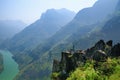 Ha Giang / Vietnam - 01/11/2017: Backpacker jumping on an outcrop overlooking a valley and karst mountains in the North Vietnamese Royalty Free Stock Photo