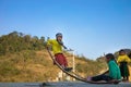 Ha Giang, Vietnam - Feb 14, 2016: Ethnic minority H`mong children play seesaw made of curved metal rod. Most of Hmong households