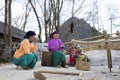 HA GIANG, VIETNAM - FEBRUARY 7: Unidentified women chat happily while weaving at home on February 7, 2014 in Ha Giang, Vietnam