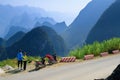 Ha Giang / Vietnam - 01/11/2017: Motorbiking backpackers on winding roads through valleys and karst mountain scenery in the North Royalty Free Stock Photo
