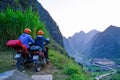 Ha Giang / Vietnam - 31/10/2017: Motorbiking backpackers on winding roads through valleys and karst mountain scenery in the North