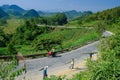 Ha Giang / Vietnam - 01/11/2017: Motorbiking backpackers on winding roads through valleys and karst mountain scenery in the North