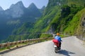 Ha Giang / Vietnam - 01/11/2017: Motorbiking backpackers on winding roads through valleys and karst mountain scenery in the North Royalty Free Stock Photo