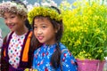 Ha Giang, Vietnam - Nov 24, 2018: Ethnic minority children with flower basket on back in Quan Ba district