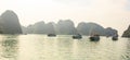 Ha Long Bay islands, tourist boats and seascape with light reflection on water, Ha Long, Vietnam