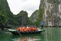 Group of tourists on traditional boat in Halong Bay