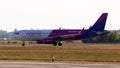 HA-LSA Wizz Air Airbus A320-200 aircraft in the sunset rays running to the Borispol International Airport parking Royalty Free Stock Photo