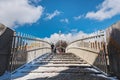 Irish landmark and community: Ha' penny Bridge covered with snow, pedestrian overpass covered by snow. Dublin, Ireland