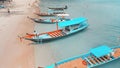 Traditional ships boats in blue azure waters on exotic tropical Koh Phangan Island