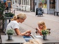 Beautiful Dutch woman mother eating ice-cream with her daughter