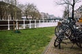 Bicycle parking lot near a canal. Royalty Free Stock Photo