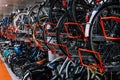 Bikes of various types and colors in a bike parking storage. Thousands of bikes in a