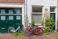 Pleasant quiet street in the city center of Haarlem with a historic dutch architecture and small houses and bicycles in the foregr Royalty Free Stock Photo