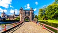 Gate and Bridge over the Moat of Castle De Haar, a 14th century Castle rebuild in the late 19th century Royalty Free Stock Photo