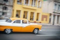 Habana, Cuba - 10 January, 2017: Old lime machine on the background of palm trees, beach and decorative fence, pure Cuban