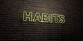 HABITS -Realistic Neon Sign on Brick Wall background - 3D rendered royalty free stock image