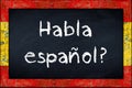 Habla espanol blackboard with spain flag frame Royalty Free Stock Photo