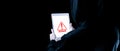 Hacker tablet cyber security. Digital mobile phone in hacker man hand isolated on black banner. Internet web hack