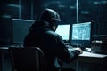 Hacker from behind using a computer in a dark room Royalty Free Stock Photo