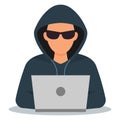 Hacker in black glasses with a laptop. Network hacking. Royalty Free Stock Photo