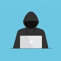 Hacker in black hood or cyber criminal at laptop.