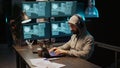 Hacker coder hacking system at night using virus Royalty Free Stock Photo