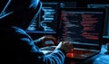 Hacker coding on laptop in dark environment, focused on screen, multiple monitors displaying code, cyber security theme