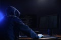 Hacker with computers in room. Cyber crime