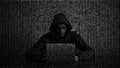 Hacker in data security concept. Hacker using laptop. Hacking the Internet. Cyber attack Royalty Free Stock Photo