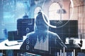 Hacker at desktop using computer with digital business interface Royalty Free Stock Photo