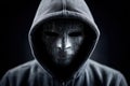 Hacker engages with multiple computer screens displaying code and binary numbers. Dark environment creates high contrast Royalty Free Stock Photo