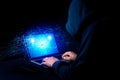 Hacker exploits AI-chip on a laptop in a dark cyber-security scene. Royalty Free Stock Photo