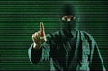 Hacker. Hacking computer data process. Man in the mask works with a digital security code.