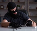 Hacker hacking computer late at night Royalty Free Stock Photo