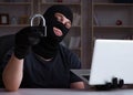 Hacker hacking computer late at night Royalty Free Stock Photo