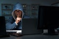 The hacker hacking computer at night