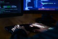 Hacker hacking computer password at night Royalty Free Stock Photo