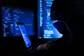 Hacker hacking computer password at night Royalty Free Stock Photo