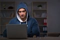 The hacker hacking the data late at night Royalty Free Stock Photo
