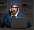 Hacker hacking the data late at night Royalty Free Stock Photo