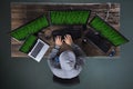 Hacker Hacking Multiple Computers On Desk